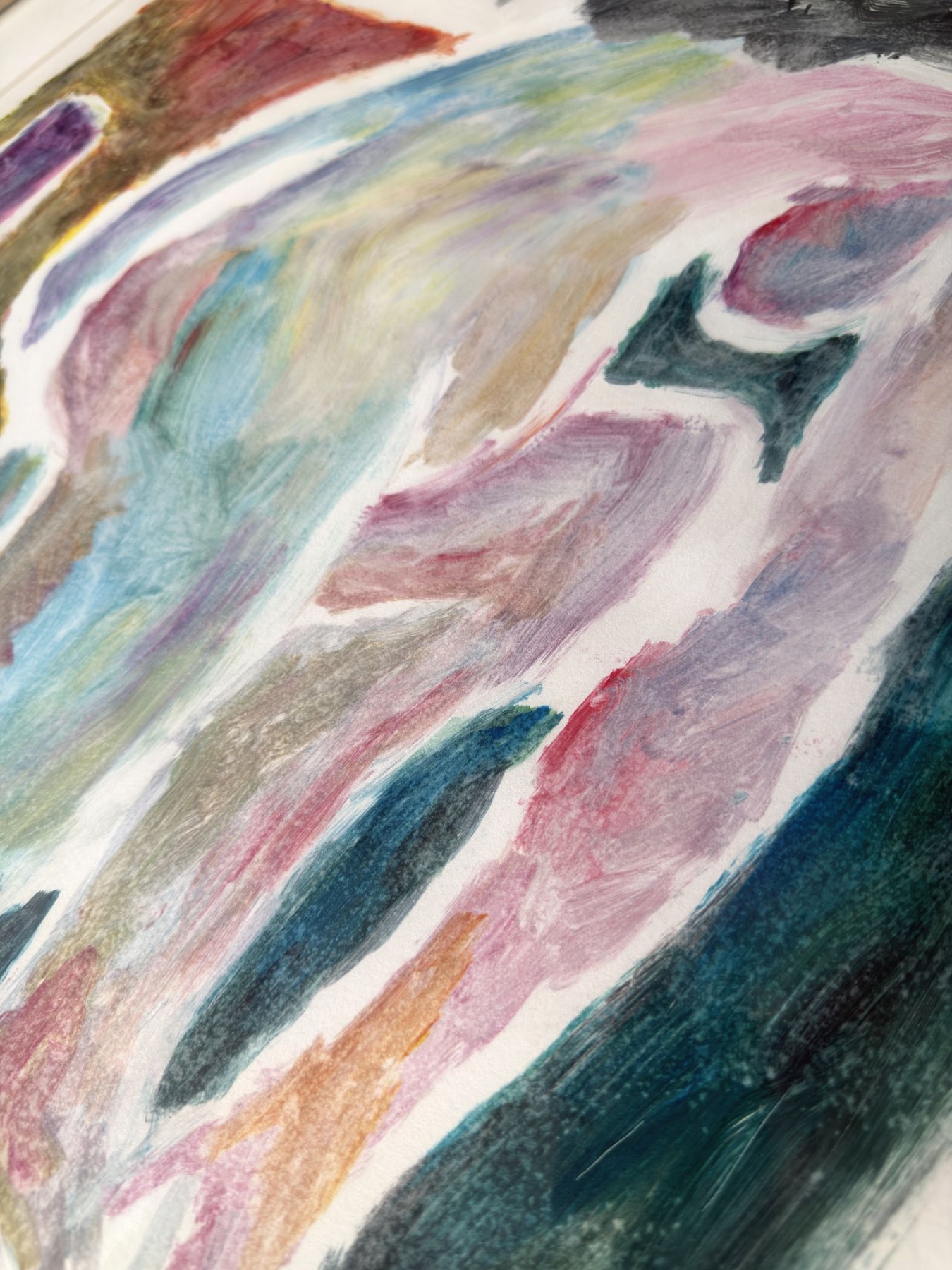 Close-up of brushstrokes in pink, teal and ochre